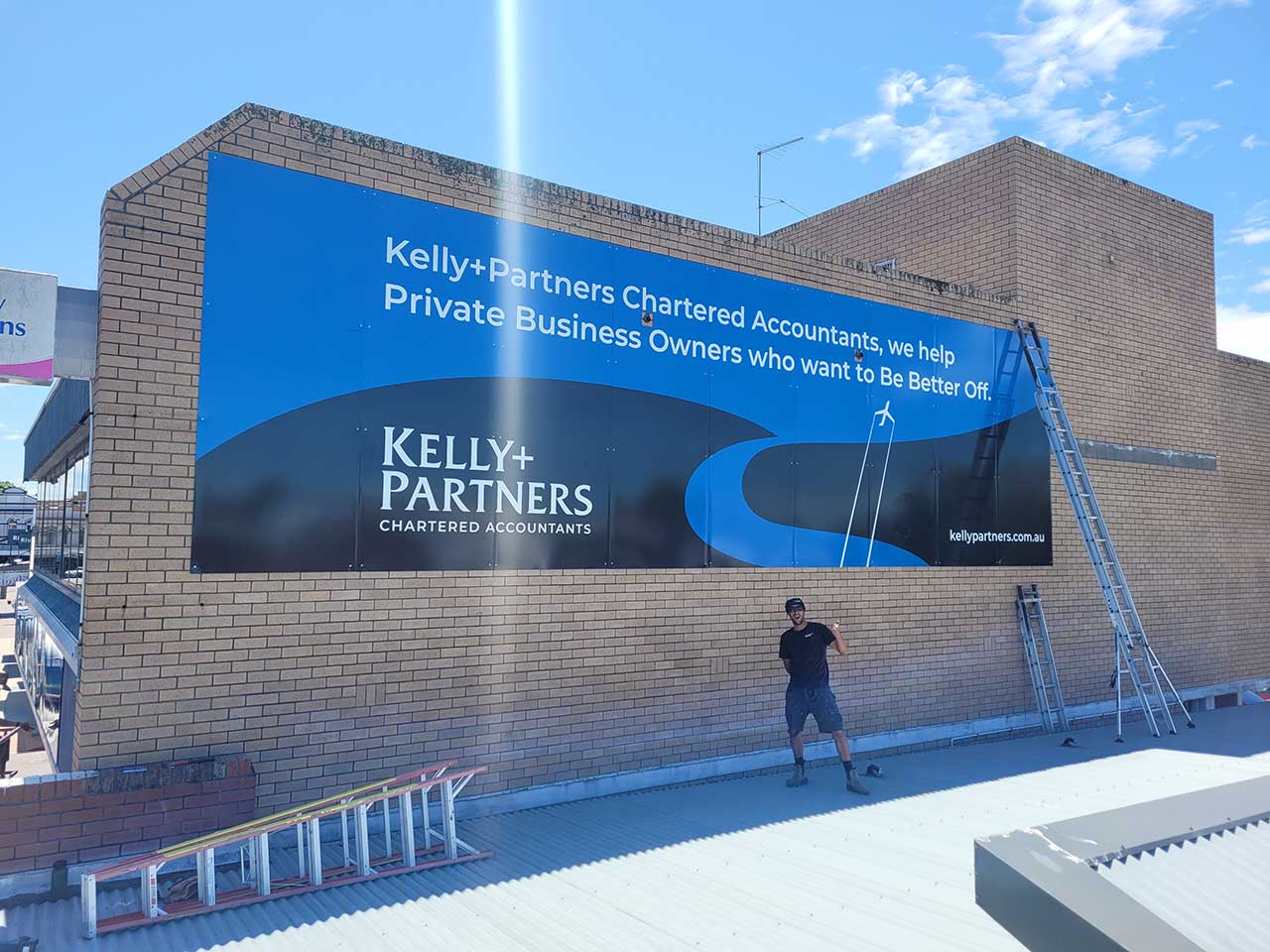 Large format building sign